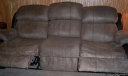 For sale is a LIKE NEW Quality Ashley (Made in USA) furniture. 2 piece couch, loveseat. Leather and micro suede. Pics are showing the true colors. A gray/taupe like micro suede with black/brown leather sides. No stains, rips or tears. SMOKE FREE HOME!