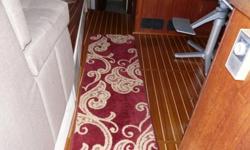 Double berth forward(new mattress) with cabinets and hanging locker. Private head and vanity starboard forward. Full enclosed head with tubbet port forward. She has a spacious galley down midship well laid out for family or business entertaining. There is