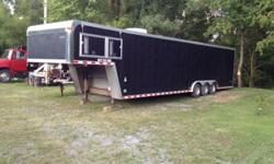 38 foot enclosed race car trailer, triple axle, Onan generator, winch, carpet, stainless steel countertops, cabinets, fluorescent lighting. 20 foot area for racecar, 18 foot living area. Air conditioning many extras. Call or text 325-949-2989. Ask for