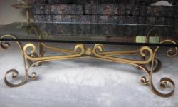 Unique 3/4" glass coffee table with wrought iron (gold ). Beautiful. Does have a very small chip- but I did want to mention VERY HEAVY. Serious inquires only.