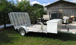 3 Bike Mototcycle Trailer in Excellent Condition. Ride On/Off Ramp, Newer Paint & Tires. Room for 3 BMW R1200GS,etc. Electric Brakes, Including in car control.&nbsp;Large cargo box, lots of tie down points, etc.
Trailer is on consignment at Jim Campon
