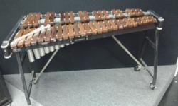 4 Octave Musser SR Model 50 - Rosewood bars Marimba with aluminum pipes on stand with rear locking casters- welded resonators- superior tone to newer models with synthetic wooden bars and brass pipes &nbsp;- good condition. Ideal for classroom, band or