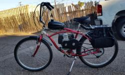 Have a 4 stroke chain drive 48cc mounted on a schwinn cruiser for sale for $350.00. In reliable condition and all funtions. has new tires, seat motor, grips. Has a set of panniers on for trips to the store or? Can legally ride without a licence needed so