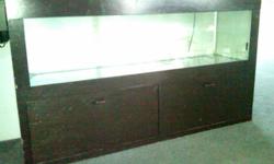 I have a 55 gallon aquarium with Dark Brown stained cabinet for sale. Absolutely no leaks!
Cabinet measures approx. 1 1/2 ft deep, approx. 5ft wide and 3 ft tall.
&nbsp;It comes with pump, filter, lights, PH meter, some decorative rocks and Mopani wood.