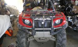 red 2005 660 yamaha grizzly. very new itp 589 tires 26". heavy duty belt, full diamond plate body armor, monster hi pro ignition, snorkel kit that can be removed extra tank and trunk plastic. 3000 lb winch about new used couple times. rear pass. pegs and