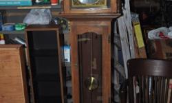 This Grandfather clock is about 6 feet tall 17 inches wide and about 11 inches deep. Has a German movement that is chain and weight driven, and strikes the westminister chime. It is in good running order and has been oiled. the upper cabinet can be