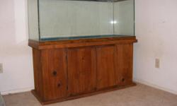 Glass Tank--75 gallon--rectangular aquarium. Can be used for salt or freshwater fish.
It's attached to a solid wood cabinet/stand with 2 doors & underneath storage.
Tank & stand measures 49" wide x 19" deep x 45 & 1/2" tall.
No accessories included. Cash
