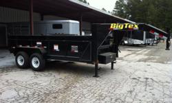This trailer is a 2012 Big Tex 14' gooseneck dump trailer. The trailer comes equipped with a fully self contained electric hydraulic dump system, rear slide in ramps, welded D-rings in bed, electric brakes on both axles, 16" 8 lug wheels, an empty weight
