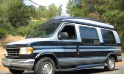Awesome high top...built by Seven 0 Seven Van Conversions and it is LOADED! Second owner. Classic blue stripe paint job. Plush blue and purple carpet throughout with beautiful wood trim. Has 165K miles, 98% highway. Could use a little fresh clearcoat on