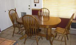 Table is 42" wide by 31" high by 5 ft. long, with one leaf ext. 6 1/2 ft., with two leaf exts. 8 ft. Comes with 8 chairs.