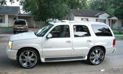 WHITE 2005 CADILLAC ESCALADE WITH 26'IN RIMS AN MUSIC IT LOOK AN RUN'S GREAT. IT'S FULLY LOADED,IT COME WITH EVERYTHING YOUR LOOKING FOR IN A CADILLAC AN YES IT HAVE A NAVIGATION SYSTEM. 3374786253