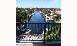 This is a remodeled top floor unit in a five story building with a great view of intersecting canals, Intracoastal Waterway and sunsets. Unit is tiled throughout with open kitchen and granite counters, seperate vanity room with walk-in closet. BOAT DOCK