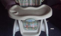 2 year old green/tan high chair; excellent condition; very clean; you pick up!