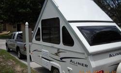 2007 Aliner LX Classic Popup Trailer Camper sleeps up to 4. A/C, 3 way refrigerater,stove which has never been used, microwave, new tires600 miles,
Length: 15'
Width: 78"
Road Height: 51"
Axle Weight: 995 lbs.
Hitch Weight: 135 lbs.
Load Capacity: 1005