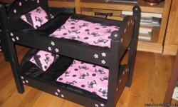 These beds are hand made, built with pine wood, they are great for any dolls but do fit the American Girl Dolls. With bedding and painted they are 90.00. We do have some unpainted, they are $65.00. Single beds are available as well they are 50.00 with