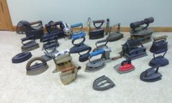 Mom's antique iron collection. &nbsp;Over 20 irons and accessories.