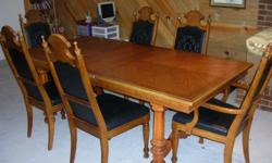 This is a large oak dinning room table with six chairs and one leef extension. My family purchases this brand new 40 years ago here in Colorado. The overall condition is excellent with no major scratches or damage. Each chair has a black vynal type pad