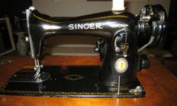 ANTIQUE SINGER SEWING MACHINE w/MATCHING CONSOLE & STOOL.
Serial #JC437279.
(JC series ? late 1940s to early 1950s).
Sewing machine is 23-1/2? x 16-1/2?.
Please call Nancy at (604) 253-7168 or (604) 325-5051