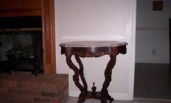 Antique table with marble top.