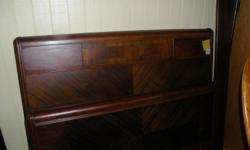 Beautiful old bed with different stained colors of wood for variation! Someone did a lot of work on this piece! It is a full size bed and I do have the original sideboards for frame. It is solid wood and very heavy, but such a nice piece! Take a look at