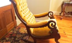 Antique Victorian Rocking Chair circa 1900's. Beautiful vintage condition. Gold Velvet upholstery with no tears or soil.&nbsp;Button Tufting strong&nbsp;and intact. Little&nbsp;or no wear on fabric.&nbsp; Wood appears to be either Walnut&nbsp;or Rosewood.