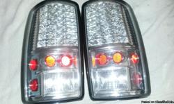 FOR SALE. Clear L.E.D. tail lights fits 01 to 03 chevy tahoe,suburban &nbsp; I LIVE in SPENCER &nbsp; &nbsp;THESE&nbsp;&nbsp;FIT NEWER THAN 03 SUBURBAN/TAHOE UP TO 2006 MAYBE. all LED's work none burnt out