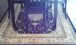 Black Area Rug, never been used. Matching Table and 4 chairs $100.00
