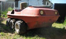 Amphibious 6x6 Argo TYPE vehicle, not an ARGO. Its is a Vesely maachine. has a JLO Rockwell single cylinder electric and manual start engine. Comet Duster clutch drives a driven pully that drives a twin transmission chain drive to all 6 wheels. Has a new