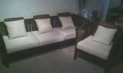 have bamboo an cream colored couch an matching chair, small frames, great for florida room!
