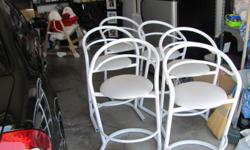 Six white bar stools, padded seat, metal frame
