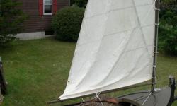 J.Howard Perrine design barnegat sneak box. Was built with plans from Mistic seaport museum of laminated ash ribs and ceder planking covered with expoxy and fiberglass cloth. comes with trailer and sails
rudder,daggerboard
