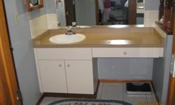 EXCELLENT condition...picture did not come out too well!
6 foot long vanity, base cabinet has storage, (30 inches wide) side is a 30 inch wide drawer on roller guides.
The vanity can be installed whole or just the base and sink.
Oval sink with "MOEN"