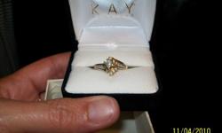 I purchased this ring from Kays about 4 years ago. It is in great shape. I believe its a size 7. I never had it resized. I paid over $800.00 for it. I hate to part with it, but really need the extra money for bills right now. I have the original paperwork