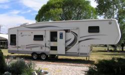 For sale by owner - 31 ft 5th wheel 2001 Mirage by Thor, bedroom & living room slides with toppers, 3 overhead fans, 1&nbsp; 120 volt and 2&nbsp; 12 volt fans with remote controls, exterior add-a room, skirt for front storage under 5th wheel, rear view