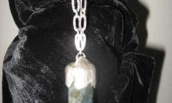 Beautiful Labadorite & Sterling Silver Artist Piece! One of a kind!! You will get many compliments on this fabulous necklace! Great for X-Mas gift!! Here is a description of the stone and it's meaning:
Metaphysical Properties: Emits a powerful light