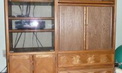 $300 or Best Offer. Must sell.
Oak entertainment center. This can be used for audio, video or television equipment. Solid oak facing and oak veneer composite construction. Two right-side, lower pull drawers. Left-side, lower two-door cabinet space. Two