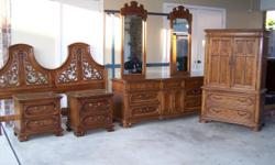 King Bedroom Set made by Thomasville. Solid wood. Set includes mirrored dresser with glass top, 2 nightstands with glass tops, Headboard, Armoire, and bedframe. Excellent condition. $2,500.00 &nbsp;Call Pam at --.&nbsp;