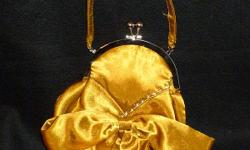 Bijoux Terner mustard gold evening bag with bow & rhinestones - EXCELLENT condition! Still has the Bijoux Terner tag inside. Perfect for a night out!
PayPal or Google Checkout accepted. I have a 100% seller rating on Ebay (under the account name of