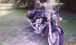 14,100 miles, loaded, mint condition, new white wall tires, handle bars up 2" from factory, kept under cover. Windshield, 3 headlights, foot boards, mustang seat w/studs saddle bags, w/passenger seat & sissy bar to match. fancy handgrips & riding
