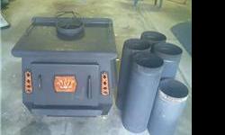 blaze princess wood stove in great condition. Comes with 9' single wall black pipe. Forced air w/thermosate.