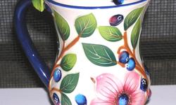 Blue Berry Bird Flower Mug by Blue Sky Clayworks
New with no tags
5 inches tall
Very beautiful mug, can be a decorative piece or maybe for Tea and even nice for a gift with some flowers or a little plant. Kind of reminds me of something you would see in