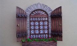 This handcrafted retablo has beautifully details flowers and rustic wooden doors to complete its appearance. The retablo is completely handcrafted in La Paz, Bolivia. This retablo measures 20.00 x 20.00cm and is offered for only $20.