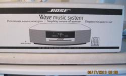BOSS WAVE RADIO WITH CD CHANGER ALSO HAS TWO REMOTES
STILL IN THE BOX