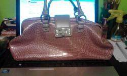 This is a brand new purse it is the brand BCB Girls. I love the color and style of the purse&nbsp;I&nbsp;just never carry a purse around. I would love for the purse to get used. It will just sit in my house till someone gets it. Text Me (850)316-0669.