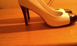 Brand new white and black heels. Size 9 the toe and heel is black. Call/text --