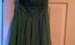 Bridemaid dress size 2 for sale. Never been worn, still has the tag attached to it. Oliver green color.