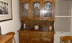 Broyhill solid oak table- 42" with two 12" leaves to expand table to 66".
six matching oak chairs, no arms
two stacked section hutch, wide 52" x deep 18" x high 81". Three leaded/beveled glass doors on top section. Three drawers and three cabinet doors on