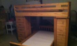 Oak bunkbed with built in 5 drawer dresser, bookcase, and desk. &nbsp;Includes bunkie boards and no mattresses.&nbsp;