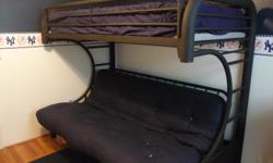 Black metal bunk bed. Twin on top, full size futon on bottom. Futon can be used in upright and sleeping positions. Full size navy blue Serta Futon Matress, twin matress, and bunky board included. Futon matress has inner springs. Bed, bunky board, and