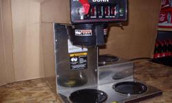This is a BUNN Model CWTF15 with 3 lower warmers. This is a commercial unit made in December of 2002, and it was taken out of a working account. Everything works. This unit is used and has a few dents and dings, but overall it is still in good condition.
